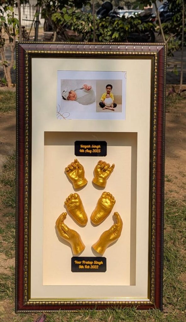 Family hand casting frame including sibling and parent hands