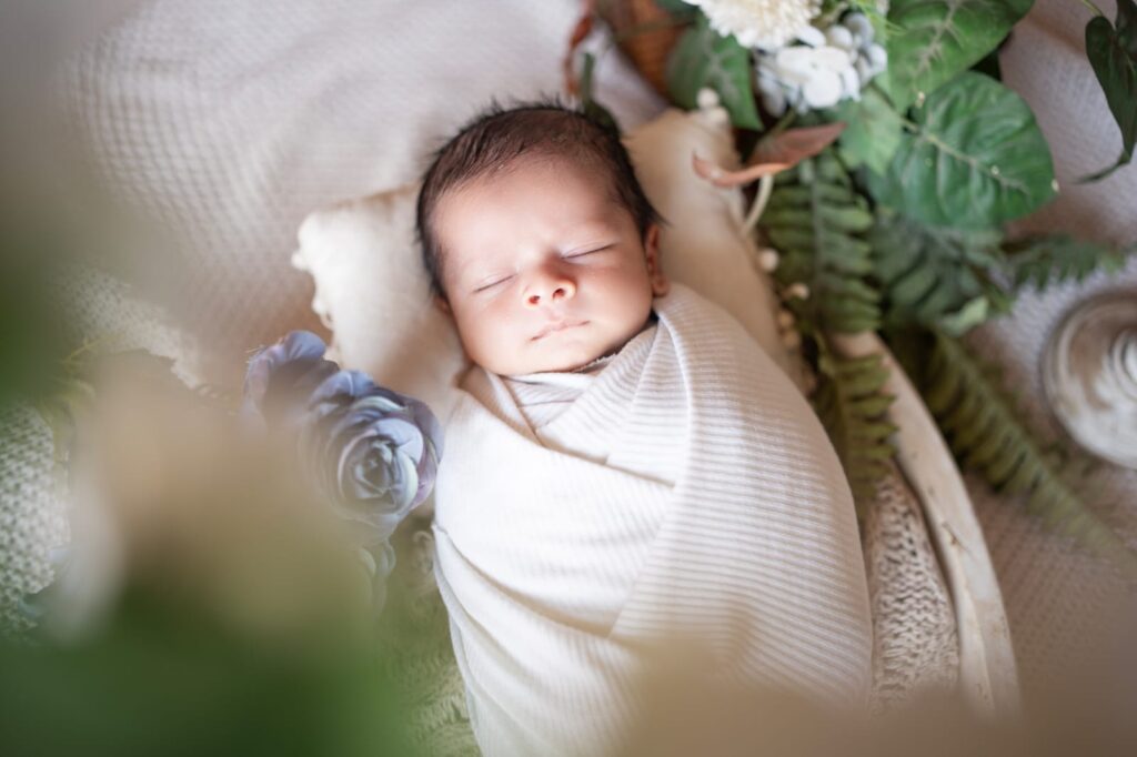 Professional newborn photography showcasing safe posing techniques by Forever with Camotions.