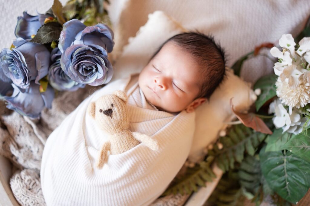 Professional newborn photography showcasing safe posing techniques by Forever with Camotions.