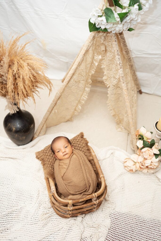 Professional newborn photography showcasing safe posing techniques by Forever with Camotions.