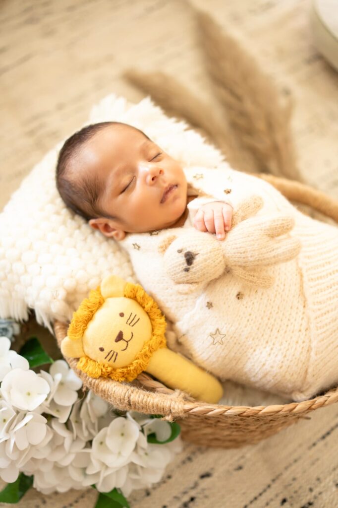 Professional newborn photography showcasing safe posing techniques by Forever with Camotions.