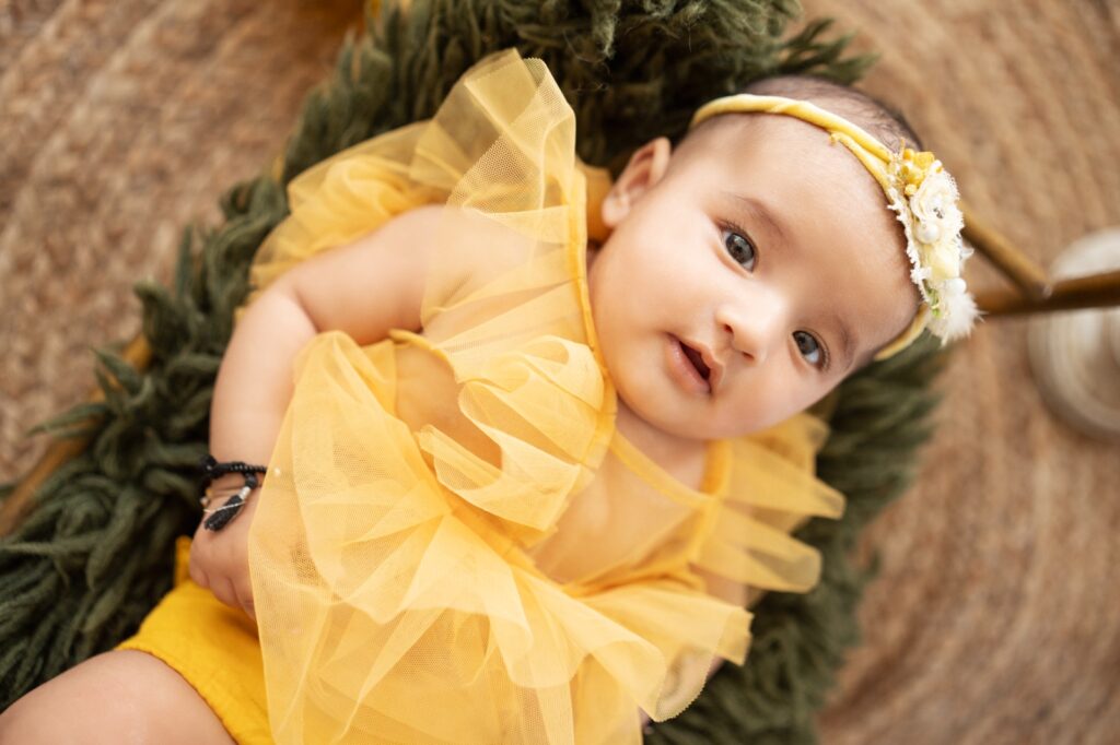 Professional newborn photography showcasing safe posing techniques by Forever with Camotions.